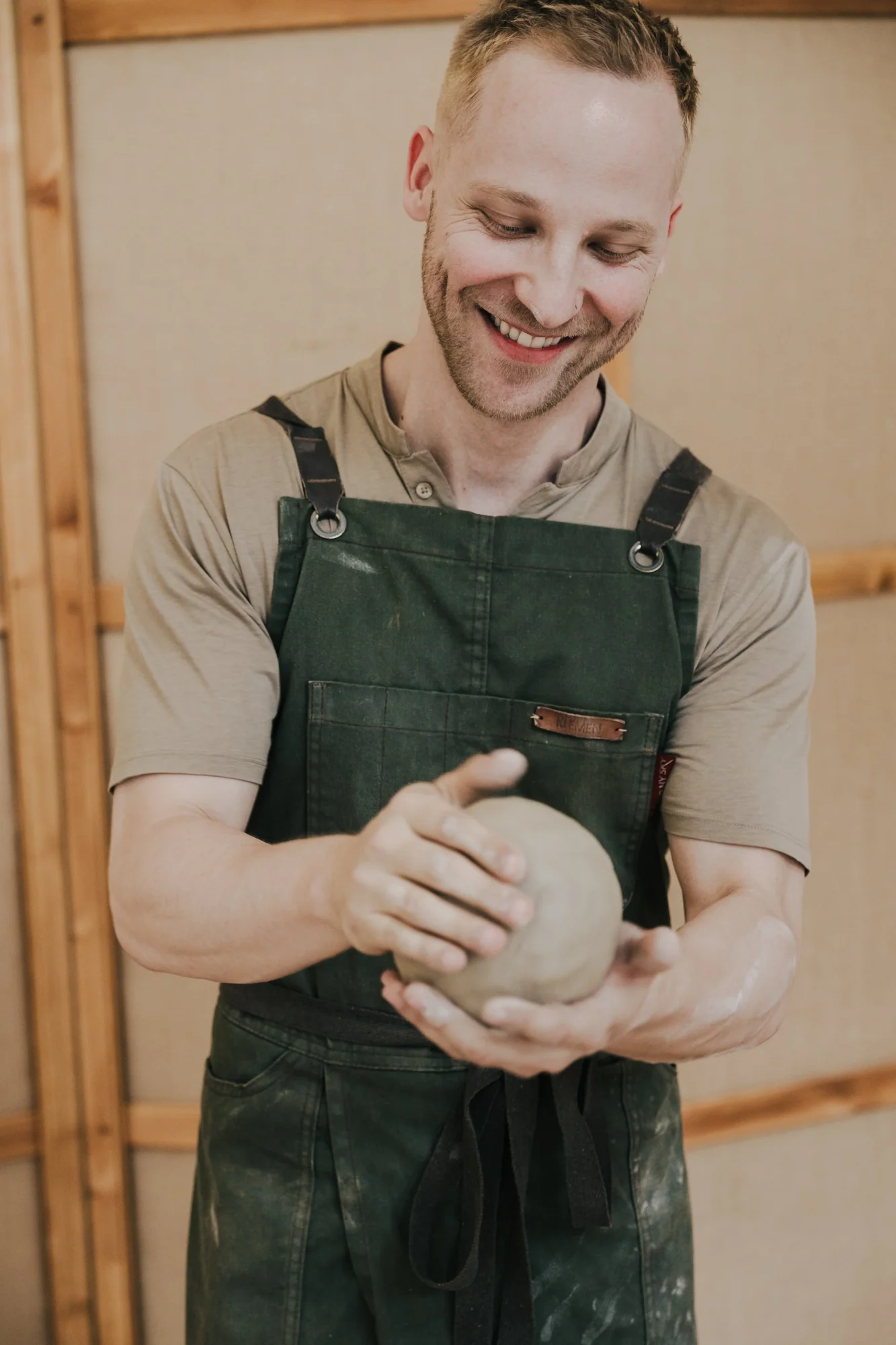 Klemen Trupej working with clay in his atelier