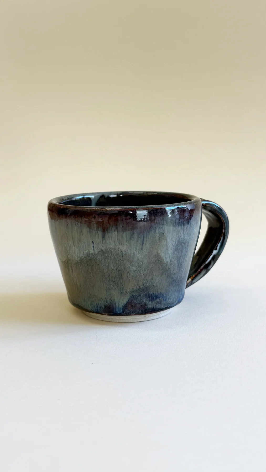 Blue-green glazed mug made by Amelia