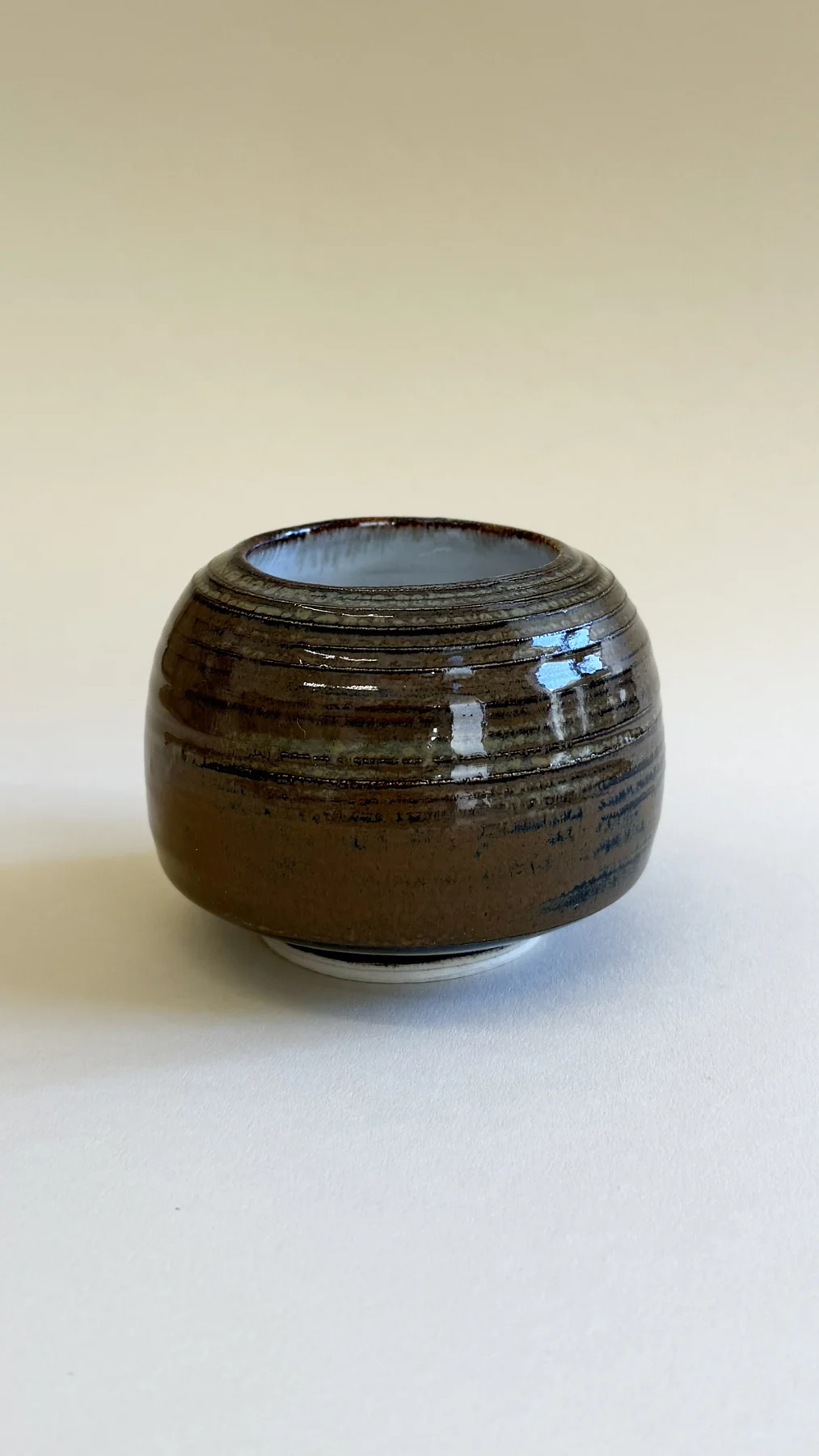 Brown glazed vase with horizontal rings made by Olga