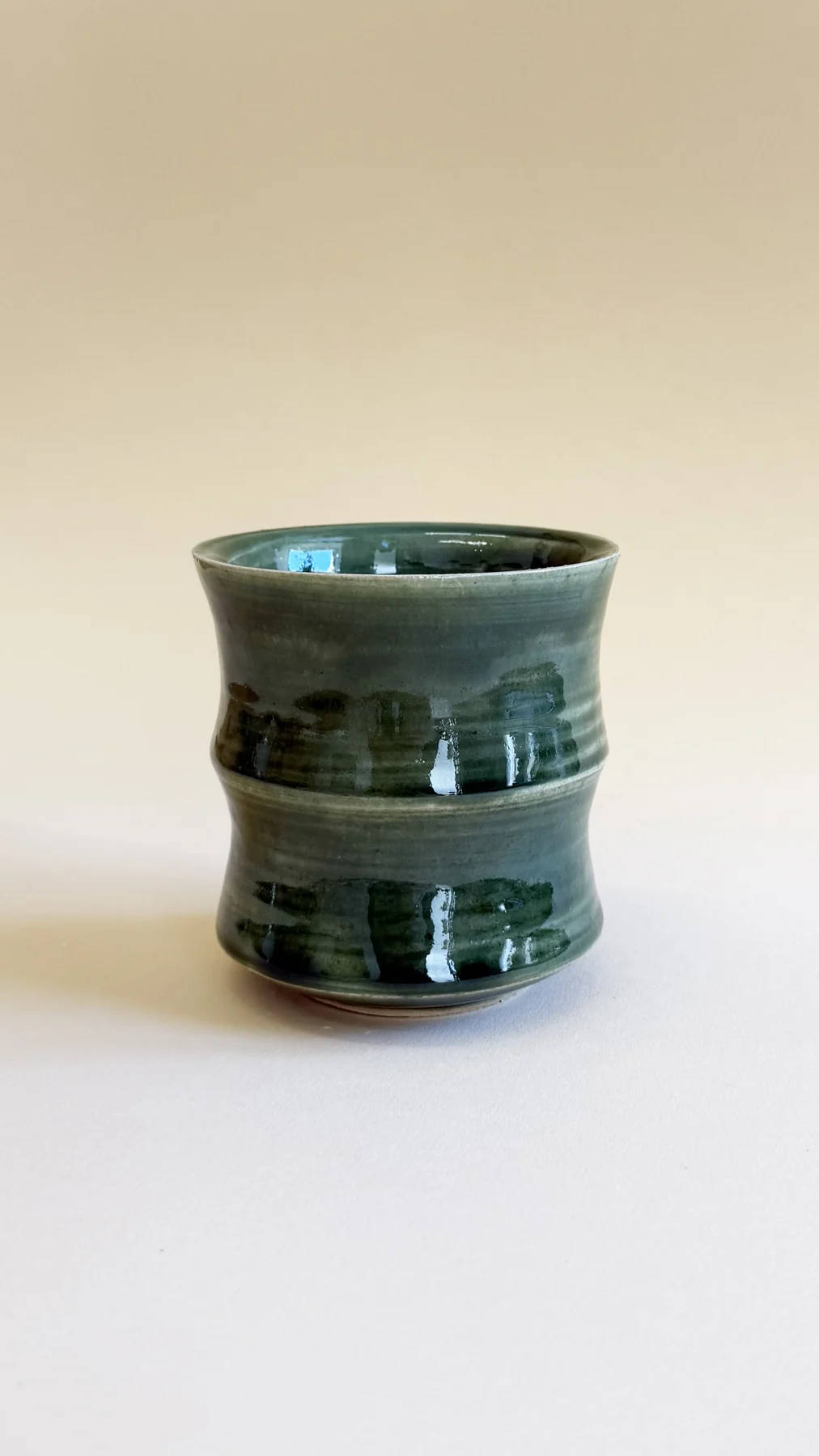 Dark green glazed vase made by Shuqin